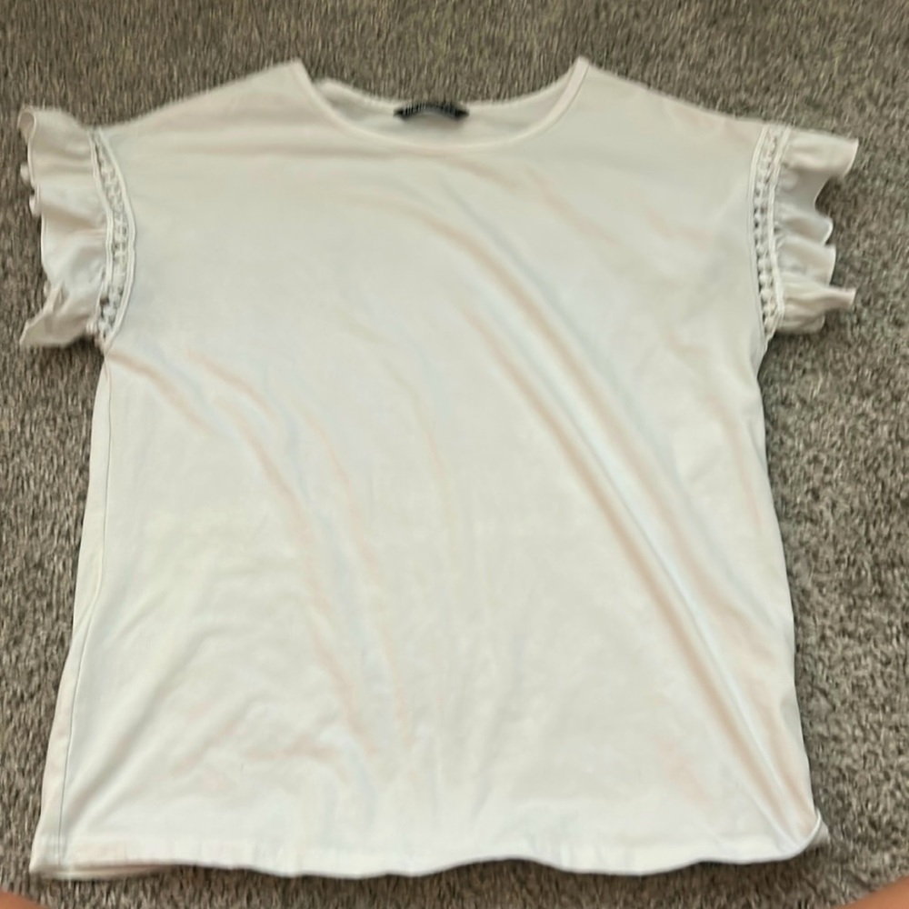 white shirt w ruffle sleeves